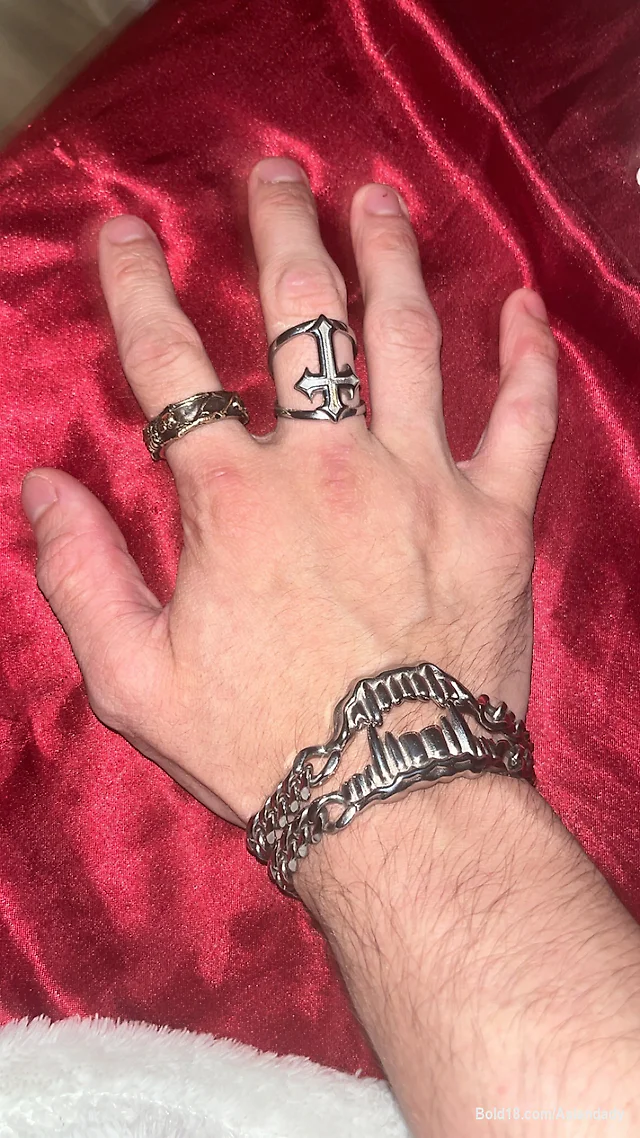 Veiny hands covered in rings